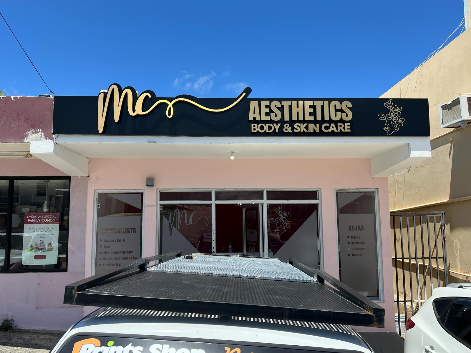 MC Aesthetics facade with gold script and black cabinet